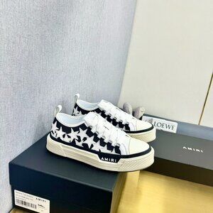 AMIRl Black Background With White Stars Low Sneakers